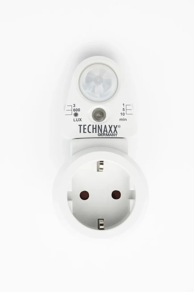 Socket adapter with motion detector and light sensor