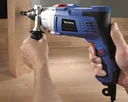Electronic impact drill 1050 watts, 2-speed including 18-piece Makita drill bit set