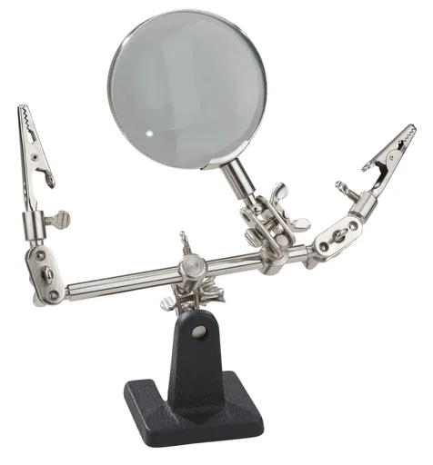 "Magnifying glass with helping hand for model making and precision mechanics image"