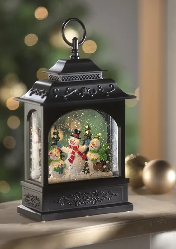 "Christmas lantern with snowman motif, light, music and snowfall effect image"