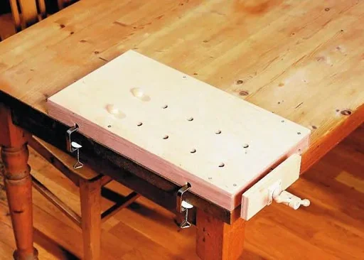 "Solid wood workbench top with clamping device and table attachment image"