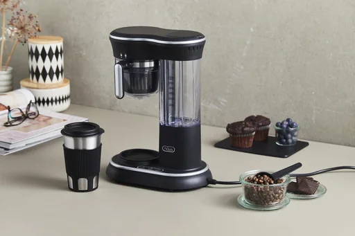"Coffee machine with grinder and stainless steel drinking cup image"