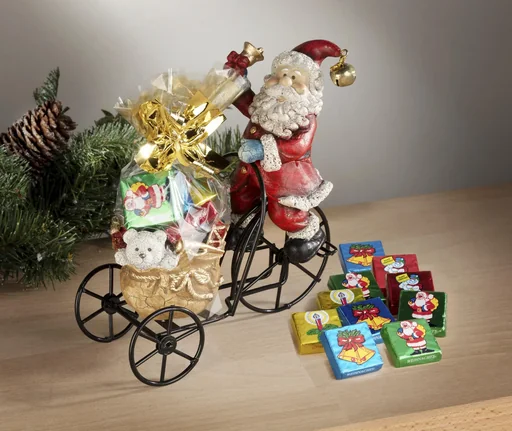 "Santa Claus on metal tricycle with tealight holder image"