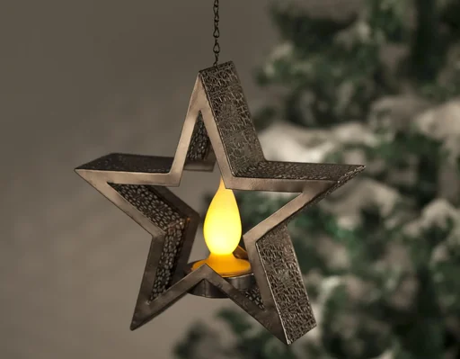 "Bronze-colored metal star with integrated candle and 10 LEDs in flame optics image"