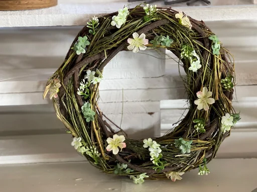 "Spring door wreath made of brushwood decorated with artificial flowers image"